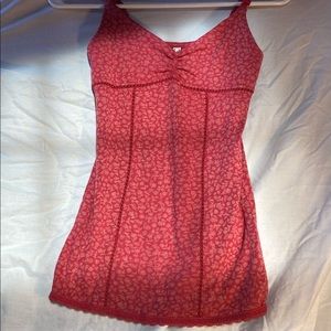 Dark red with a hint of purple sleeveless top with flower pattern